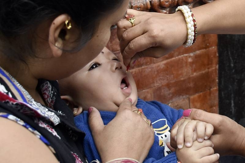 Vitamin ‘A’ and deworming medicine being given to children