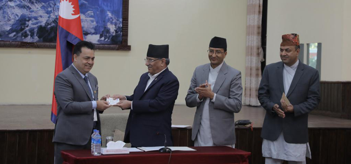 PM Dahal hands citizenship certificates to NRNs